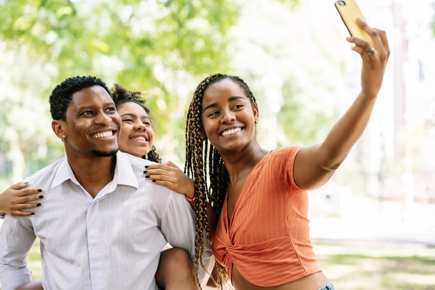 african american family having fun enjoying day park while taking selfie together with mobile phone 58466 15884