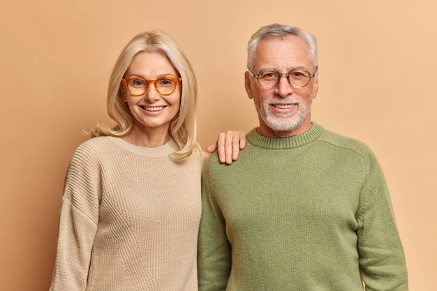 half length shot pleased middle aged woman man smile pleasantly wear jumpers spectacles 273609 46001