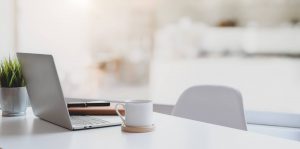 Insurance Tips 6 Modern Workplace With Laptop Computer Coffee Cup Office Supplies 1